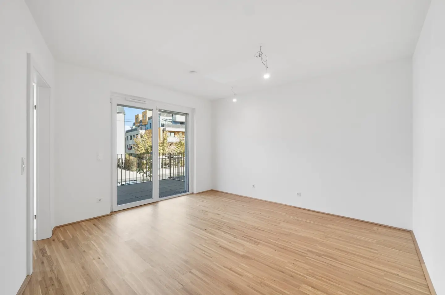 Modern first-occupancy rental apartments with private outdoor areas and garage in the 21st district