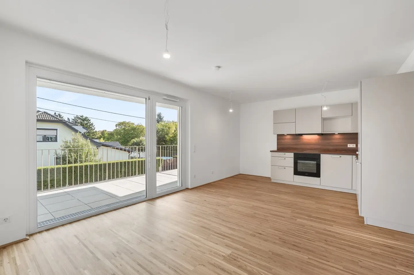 Modern first-occupancy rental apartments with private outdoor areas and garage in the 21st district