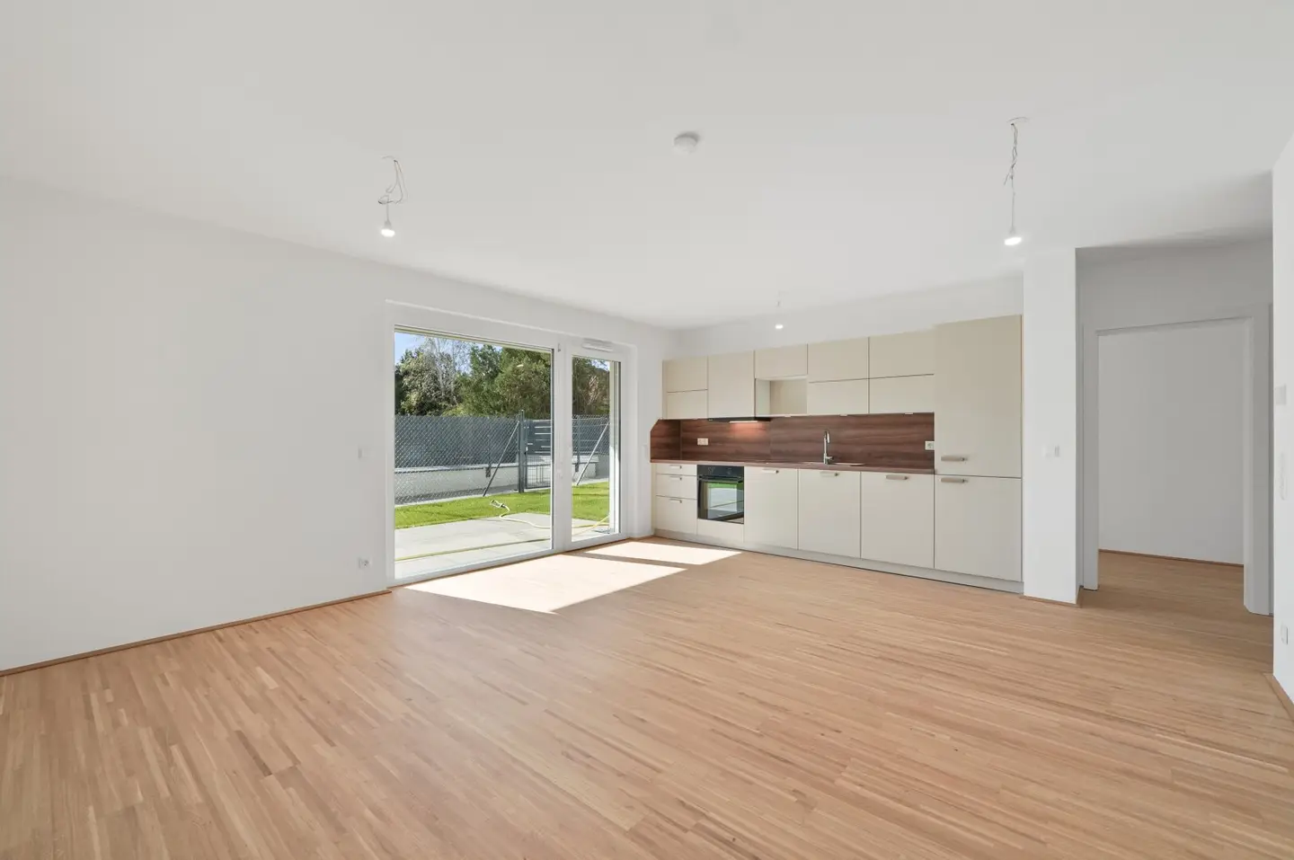 Modern first-occupancy rental apartments with private outdoor areas and garage in the 21st district