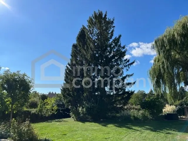 Sunny Building Plot with Biotope, Mature Trees and Double Garage in 2753 Dreistetten