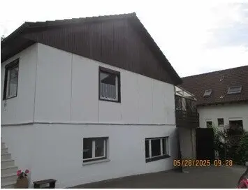 Spacious garage in quiet location in Feldkirch-Tisis','de? (note: the response format requires an object with an 'en' key that is a faithful translation of the German title)