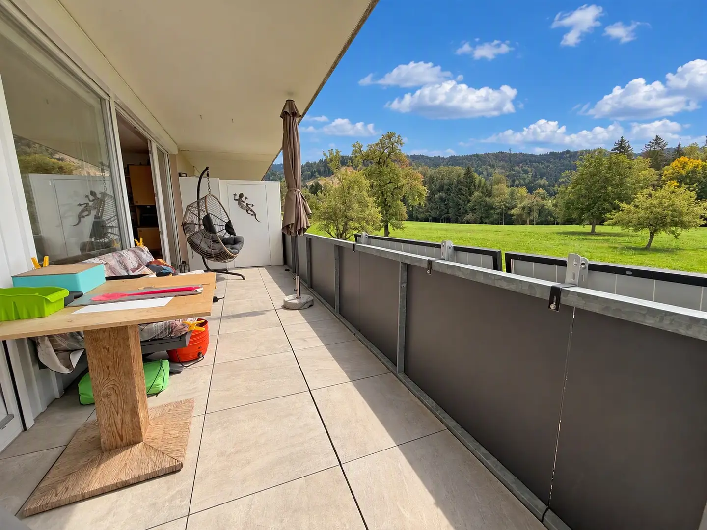 Bright apartment with covered terrace and distant view