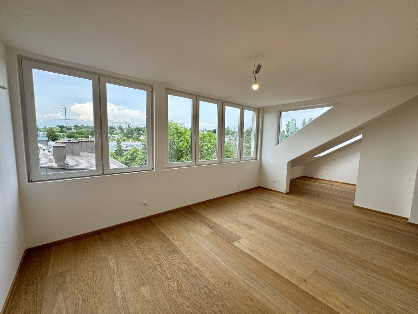 Exclusive attic conversion in elite location – Stylish penthouses above the roofs of the city!