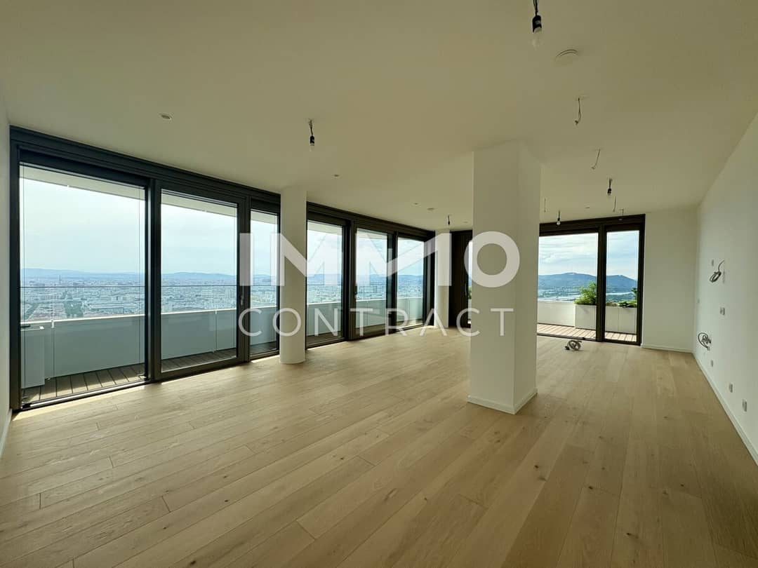 Apartment with Danube view in a modern highrise featuring a heated pool