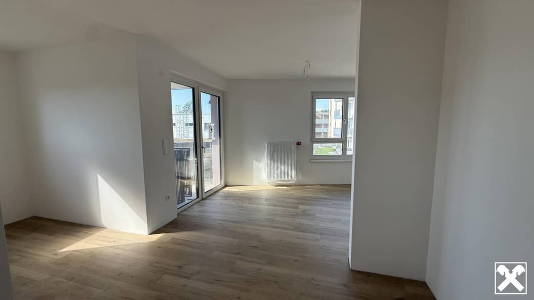 Wohnung im Neubau mit Balkon und Tiefgaragenplatz
