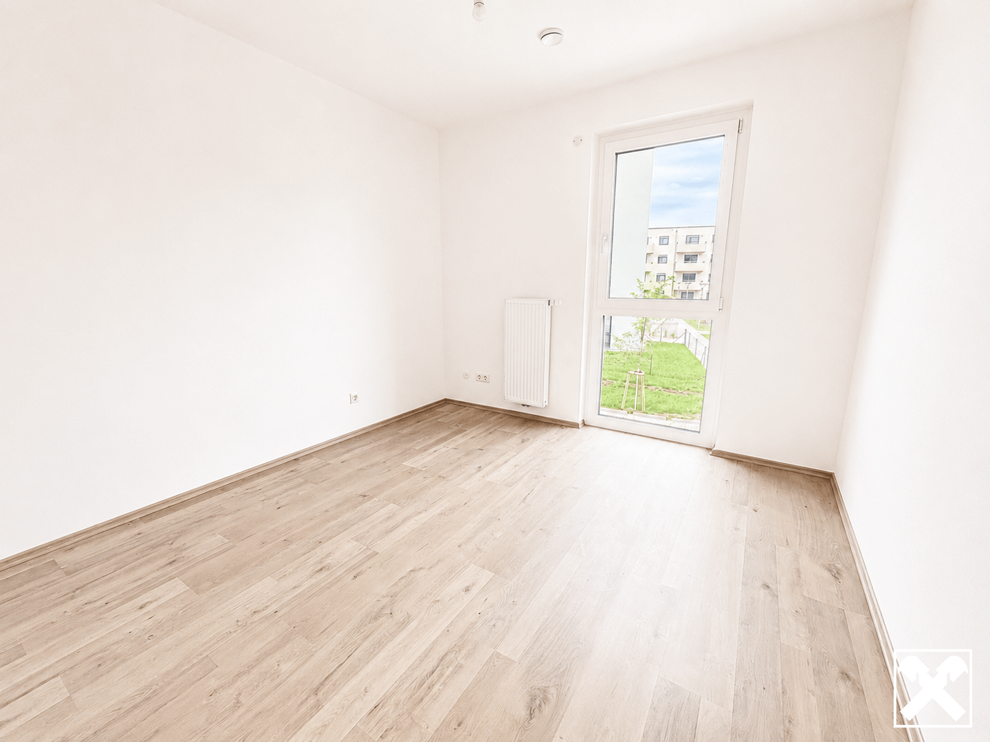 Apartment in a green area with balcony and underground parking
