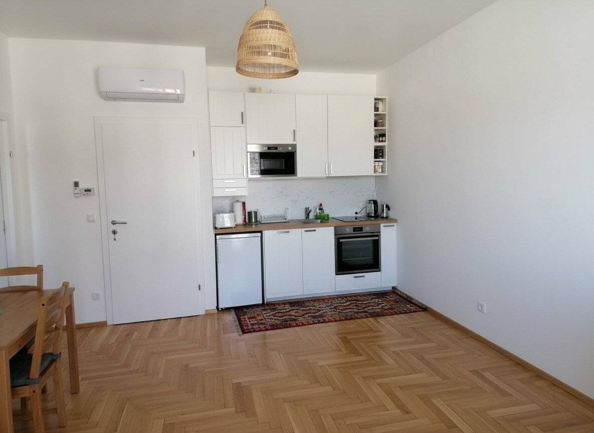 Air conditioned two room apartment with courtyard facing terrace and optional garage parking space